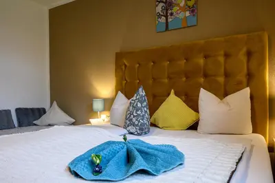 Ein Bett oder Betten in einem Zimmer der Unterkunft Restaurant Appartements Almdiele