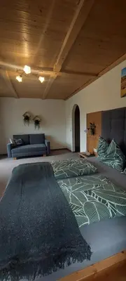 Ein Bett oder Betten in einem Zimmer der Unterkunft Maurerhof Itter
