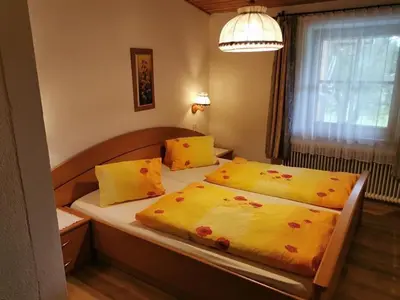 Ein Bett oder Betten in einem Zimmer der Unterkunft Biobauernhof und Ferienhaus Riederbauer