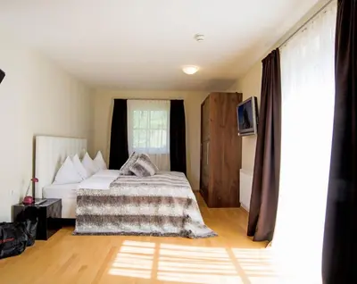 Ein Bett oder Betten in einem Zimmer der Unterkunft Chalet Alpinresort