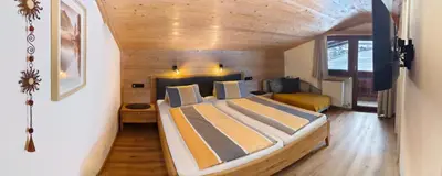 Ein Bett oder Betten in einem Zimmer der Unterkunft Gästehaus Midi