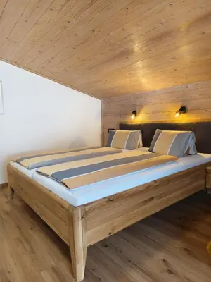 Ein Bett oder Betten in einem Zimmer der Unterkunft Gästehaus Midi