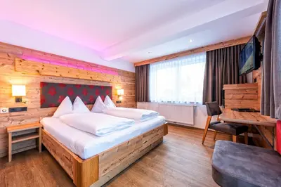 Ein Bett oder Betten in einem Zimmer der Unterkunft Hotel Garni Siegmundshof - inclusive Joker Card im Sommer