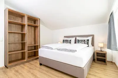 Ein Bett oder Betten in einem Zimmer der Unterkunft Apartment Rainer - mittendrin
