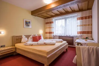 Ein Bett oder Betten in einem Zimmer der Unterkunft Gästehaus Gisela