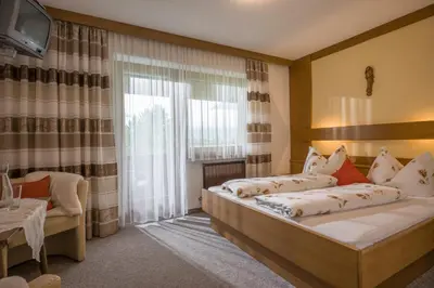 Ein Bett oder Betten in einem Zimmer der Unterkunft Gästehaus Gisela