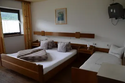 Ein Bett oder Betten in einem Zimmer der Unterkunft Gästehaus Wildauer