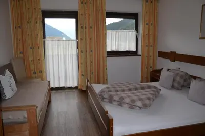 Ein Bett oder Betten in einem Zimmer der Unterkunft Gästehaus Wildauer