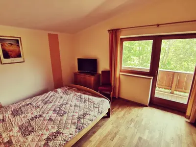 Ein Bett oder Betten in einem Zimmer der Unterkunft Ferienwohnung Grabner