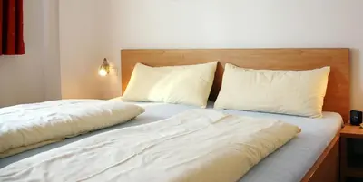 Ein Bett oder Betten in einem Zimmer der Unterkunft Ski in out! Gemütliche Dachgeschosswohnung