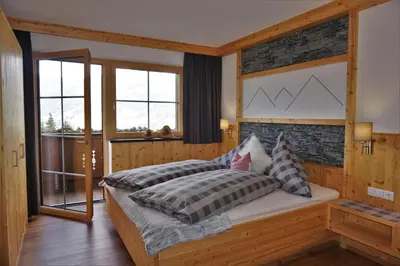 Ein Bett oder Betten in einem Zimmer der Unterkunft Apartment Alpenstyle by Katharina