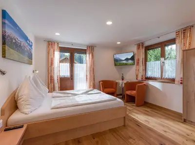 Ein Bett oder Betten in einem Zimmer der Unterkunft Haus Salvenmoser