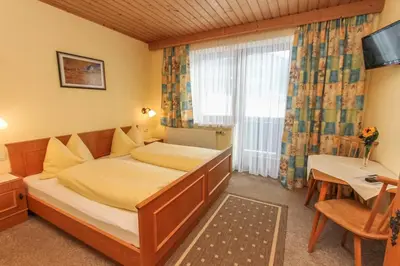 Ein Bett oder Betten in einem Zimmer der Unterkunft Schneiderbauer