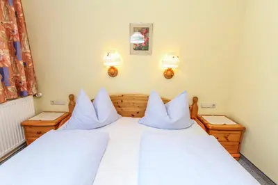 Ein Bett oder Betten in einem Zimmer der Unterkunft Schneiderbauer