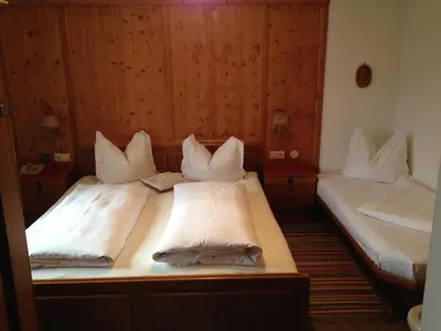 Ein Bett oder Betten in einem Zimmer der Unterkunft Bichlhof