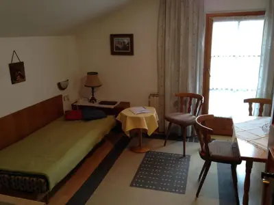 Ein Bett oder Betten in einem Zimmer der Unterkunft Bichlhof