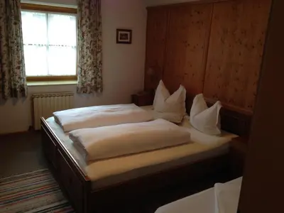 Ein Bett oder Betten in einem Zimmer der Unterkunft Bichlhof