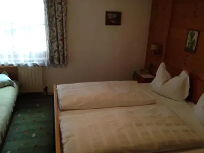 Ein Bett oder Betten in einem Zimmer der Unterkunft Bichlhof
