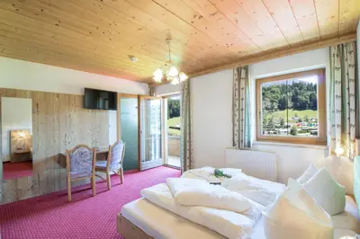 Ein Bett oder Betten in einem Zimmer der Unterkunft Haflingerhof