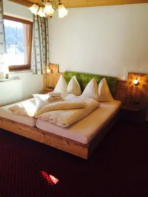 Ein Bett oder Betten in einem Zimmer der Unterkunft Haflingerhof
