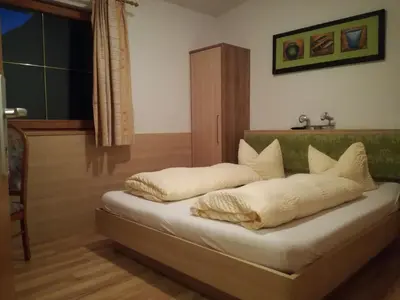 Ein Bett oder Betten in einem Zimmer der Unterkunft Haflingerhof