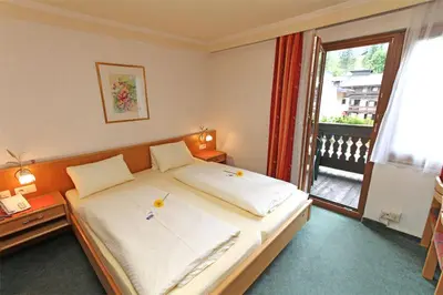 Ein Bett oder Betten in einem Zimmer der Unterkunft Hotel Mitterer