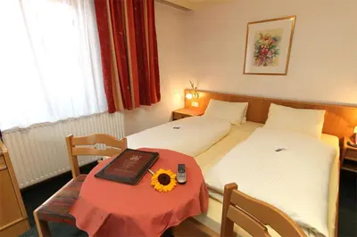 Ein Bett oder Betten in einem Zimmer der Unterkunft Hotel Mitterer