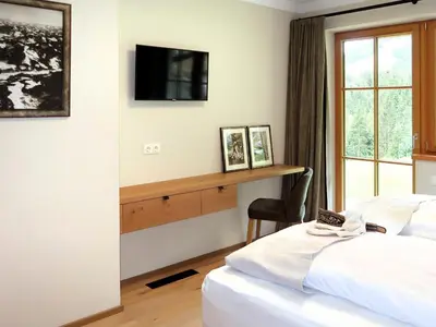 Ein Bett oder Betten in einem Zimmer der Unterkunft Apartment Chalet Edelweiß by Interhome