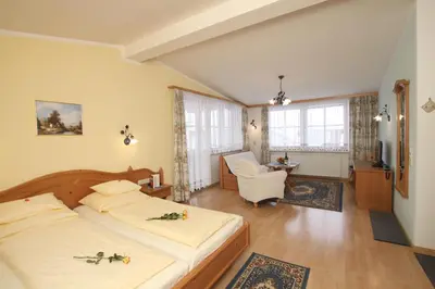 Ein Bett oder Betten in einem Zimmer der Unterkunft Hotel Sonne