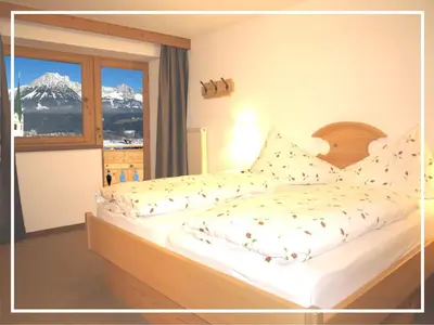 Ein Bett oder Betten in einem Zimmer der Unterkunft KAISERapart ELLMAU Zentrum