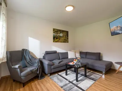 Ein Sitzbereich in der Unterkunft Ferienhaus am Erlachhof