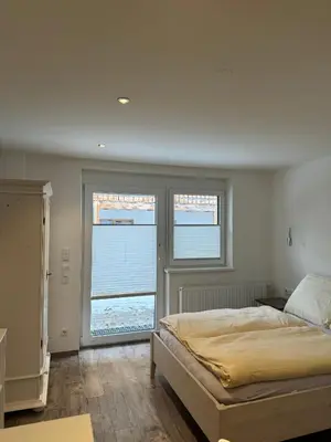 Ein Bett oder Betten in einem Zimmer der Unterkunft SKILL Mountain Lodge - Ski und Bike Hostel im Sommer mit JOKER CARD