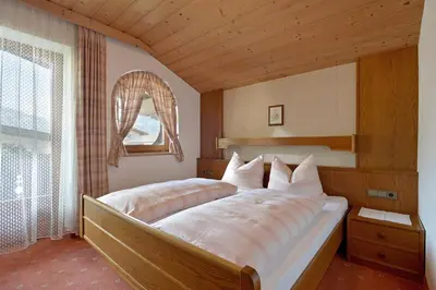 Ein Bett oder Betten in einem Zimmer der Unterkunft Ferienwohnungen Johanna