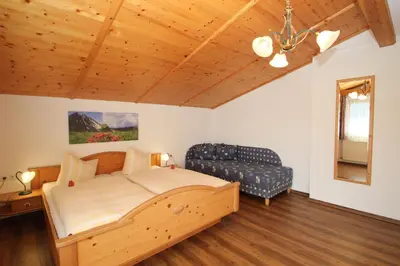 Ein Bett oder Betten in einem Zimmer der Unterkunft Obermooshof