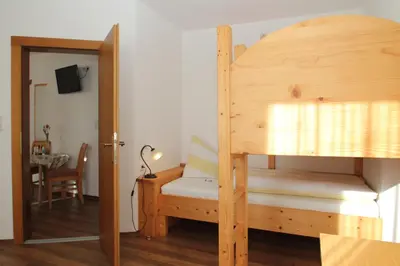 Ein Bett oder Betten in einem Zimmer der Unterkunft Obermooshof