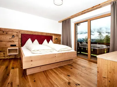 Ein Bett oder Betten in einem Zimmer der Unterkunft Chalet in Jochberg with Sauna & Mountain Views