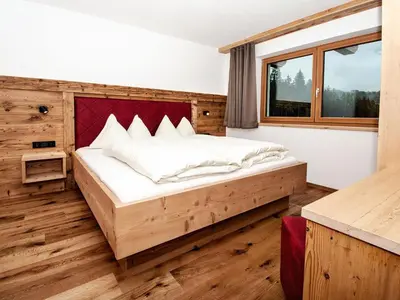 Ein Bett oder Betten in einem Zimmer der Unterkunft Chalet in Jochberg with Sauna & Mountain Views