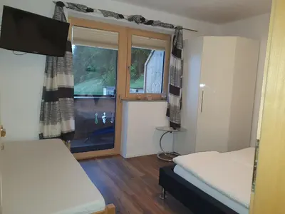 Ein Bett oder Betten in einem Zimmer der Unterkunft Gästehaus Flörl 1
