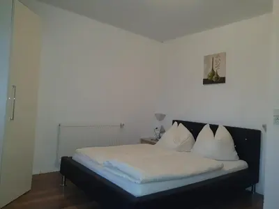 Ein Bett oder Betten in einem Zimmer der Unterkunft Gästehaus Flörl 1