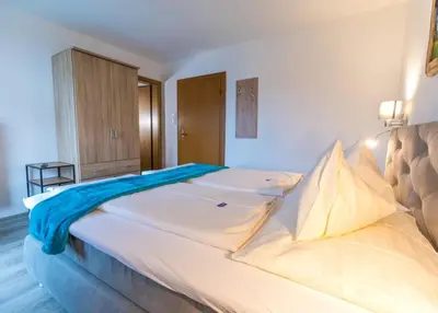 Ein Bett oder Betten in einem Zimmer der Unterkunft Haus Landmann