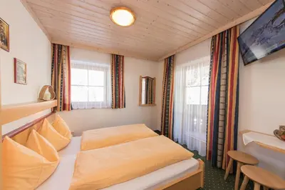 Ein Bett oder Betten in einem Zimmer der Unterkunft Appartement-Gästehaus Marie Anderl
