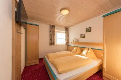 Ein Bett oder Betten in einem Zimmer der Unterkunft Appartement-Gästehaus Marie Anderl