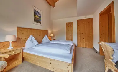 Ein Bett oder Betten in einem Zimmer der Unterkunft Sportpension Enzian