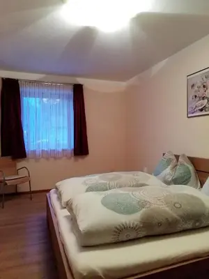 Ein Bett oder Betten in einem Zimmer der Unterkunft Haus Valentina