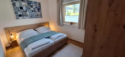 Ein Bett oder Betten in einem Zimmer der Unterkunft Apartment Wechselberger Tobias & Jaqueline