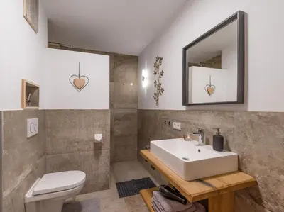 Ein Badezimmer in der Unterkunft Appartement Holznest