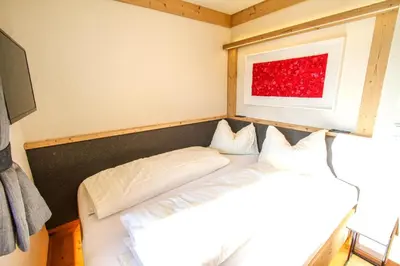 Ein Bett oder Betten in einem Zimmer der Unterkunft Enzian Wohnung B