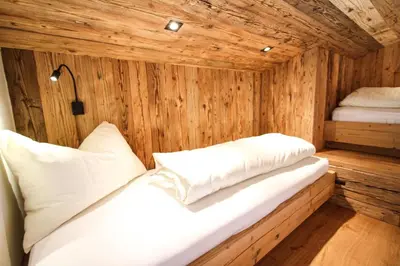 Ein Bett oder Betten in einem Zimmer der Unterkunft Enzian Wohnung A