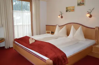 Ein Bett oder Betten in einem Zimmer der Unterkunft Landhaus Montana