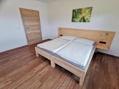 Ein Bett oder Betten in einem Zimmer der Unterkunft Ferienwohnung Kramerhof